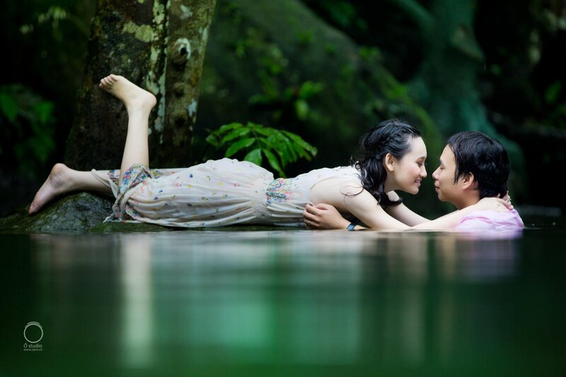 Couple in a forest stream