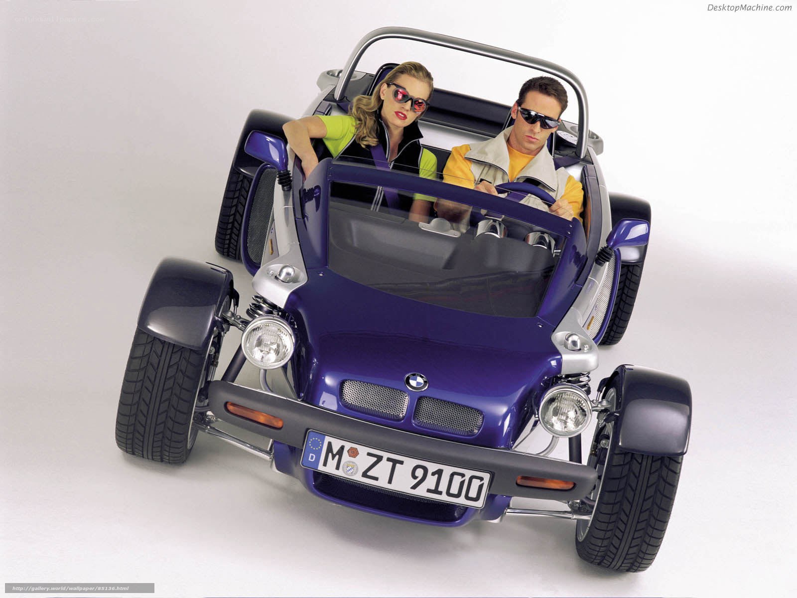 Couple in a purple BMW roadster