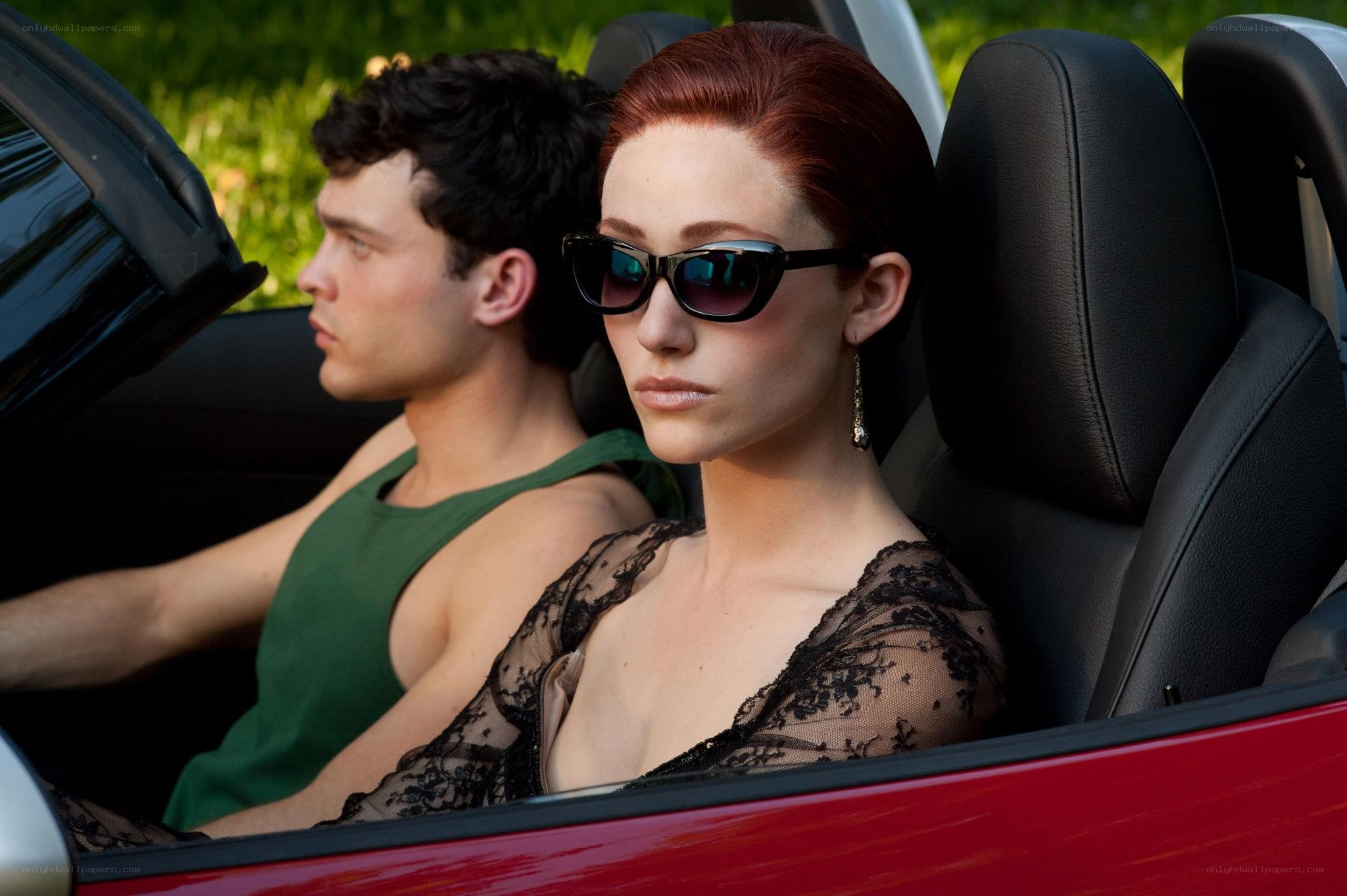 Couple in a red convertible