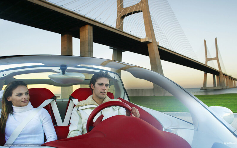 Couple in a red sports car