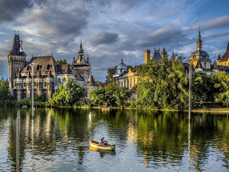 Couple in a Rowboat — Green, Serene, Sunset