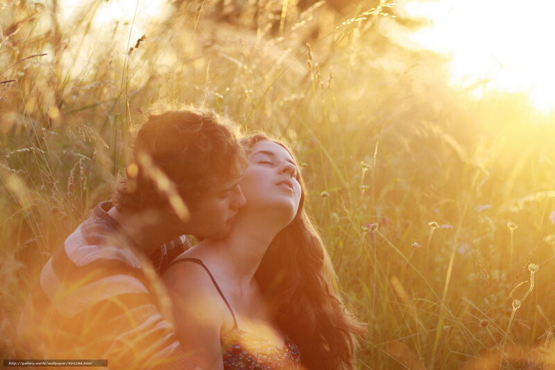 Couple in a sunlit field