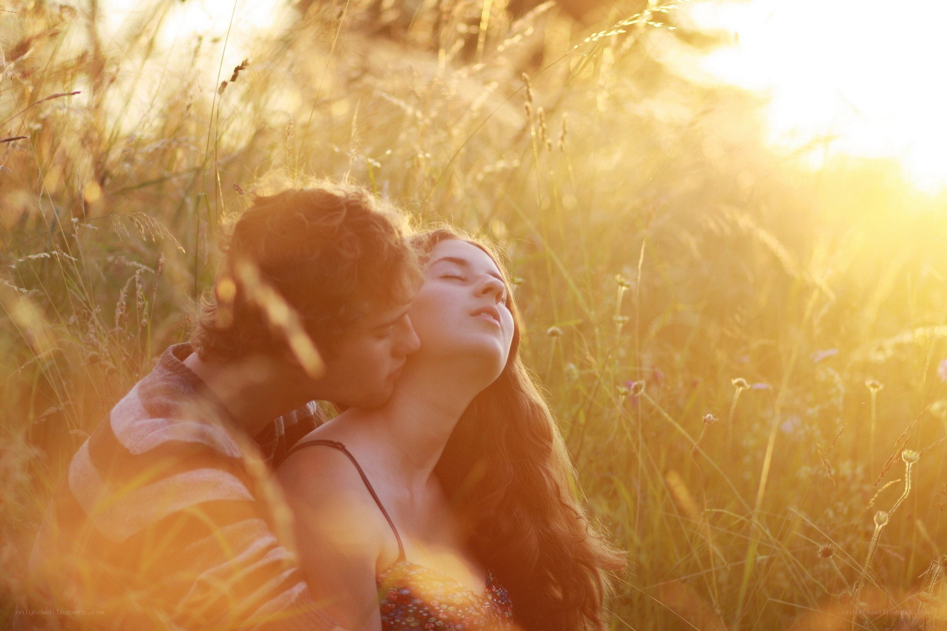 Couple in a sunlit field