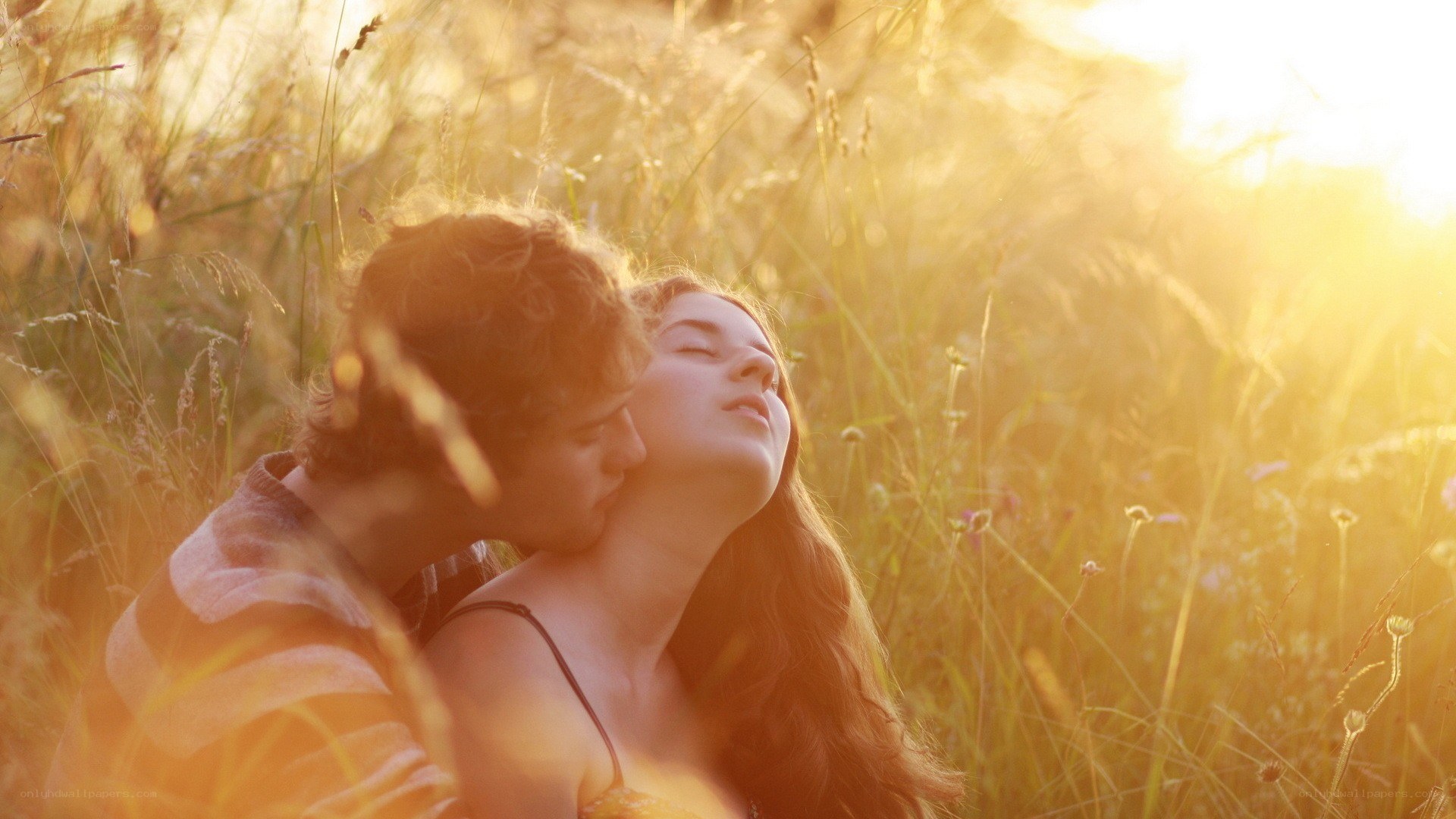 Couple in a sunlit field