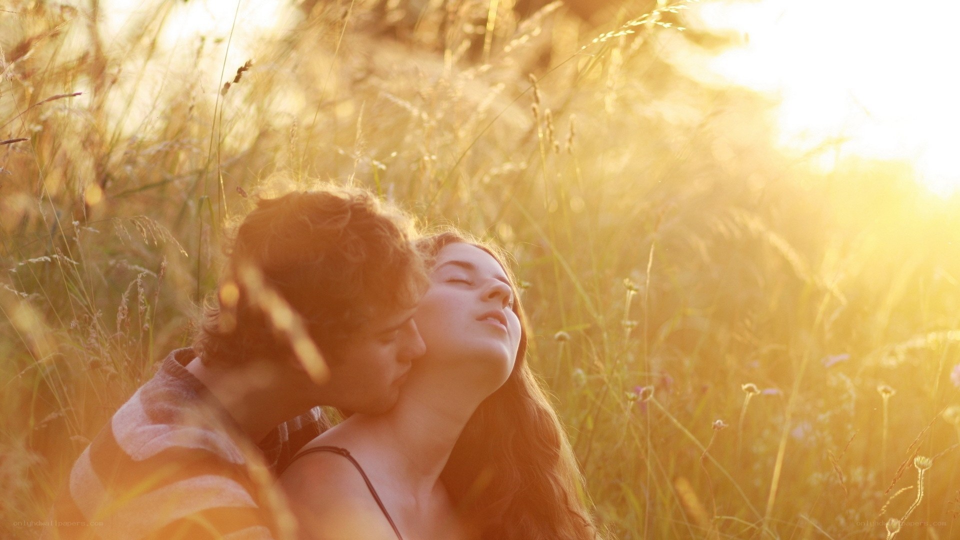 Couple in a sunlit field