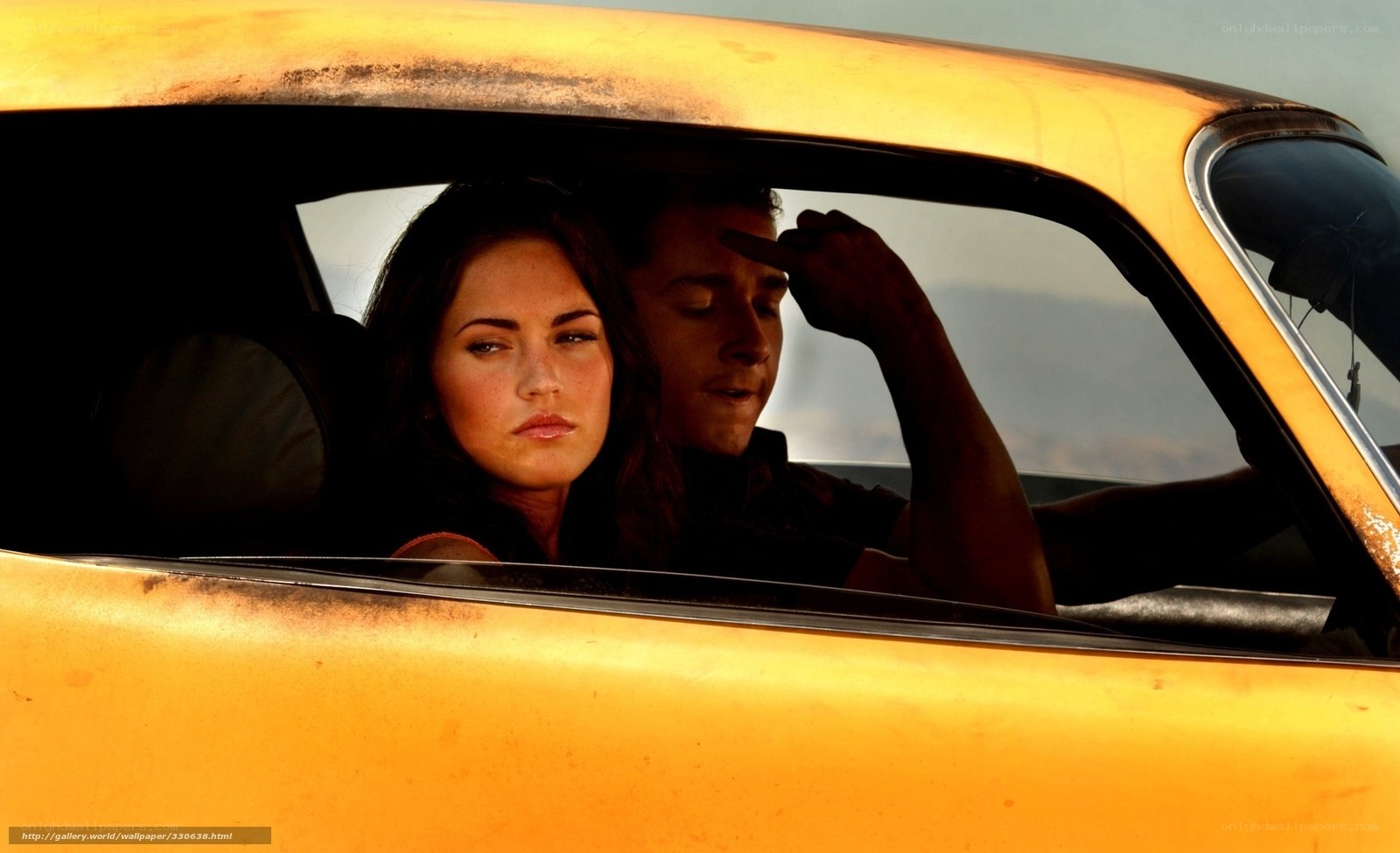 Couple in a yellow car