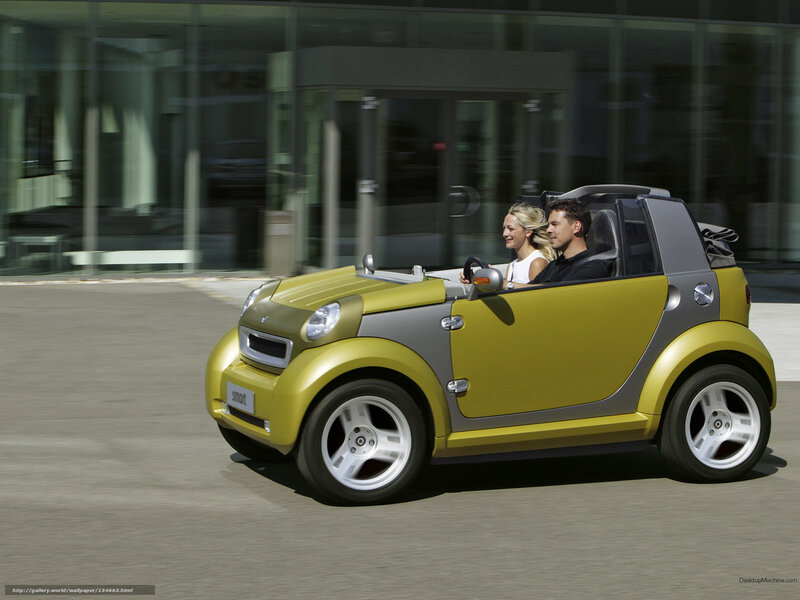 Couple in a yellow smart car