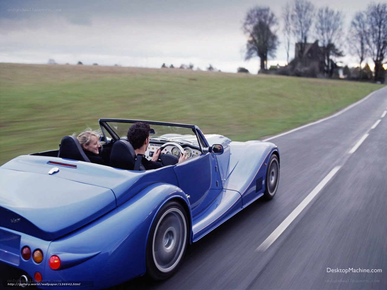 Couple in blue convertible car