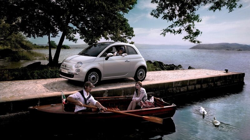 Couple in boat near car