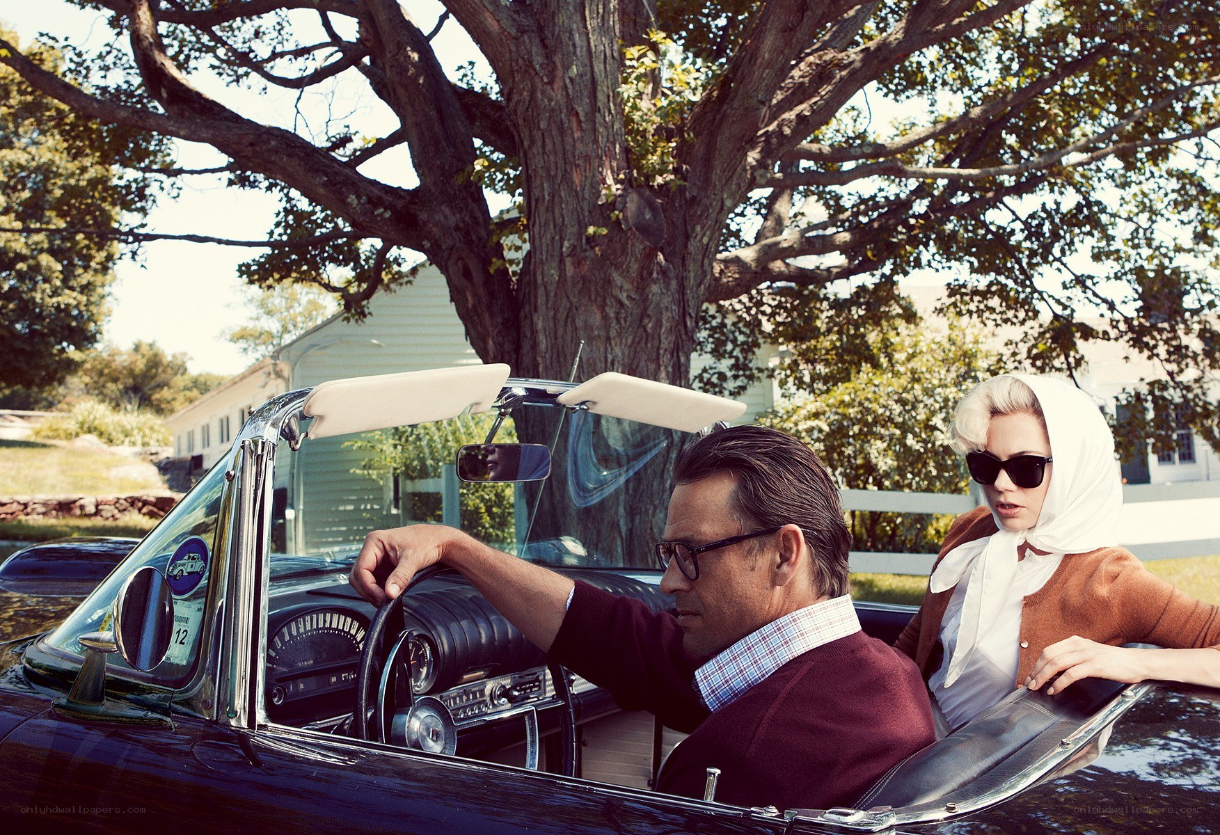 Couple in classic convertible