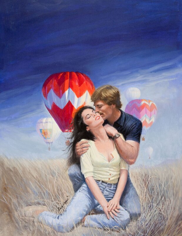 Couple in field with hot air balloons