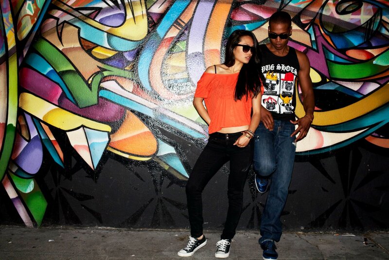 couple in front of graffiti wall
