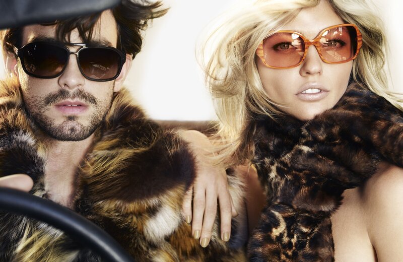 Couple in fur coats and sunglasses