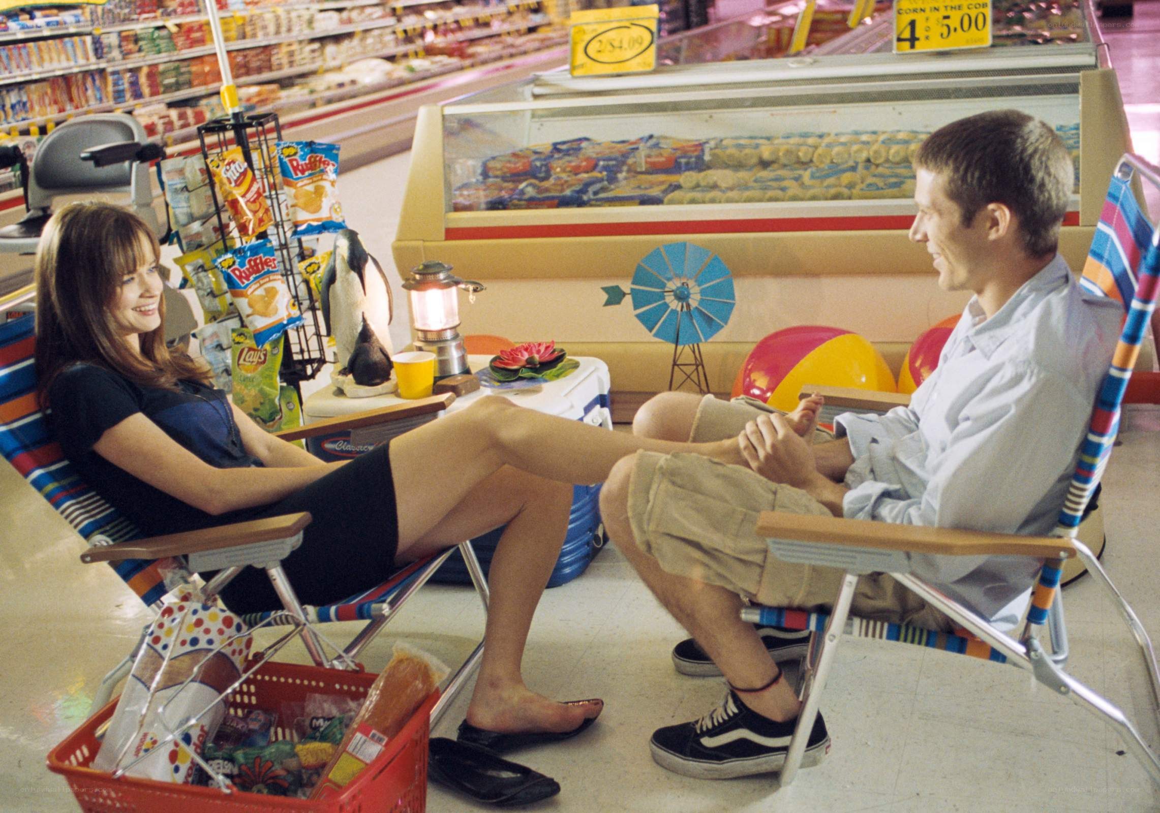 Couple in grocery store chairs
