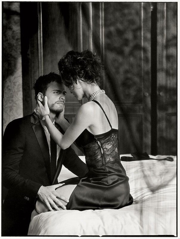 Couple in intimate pose on bed