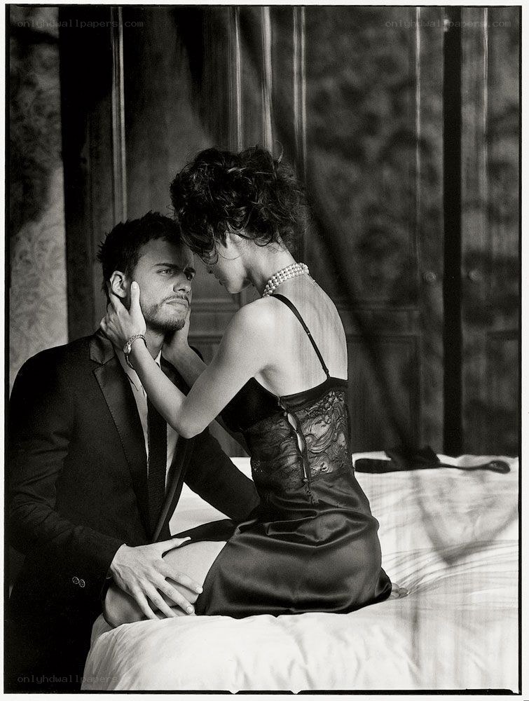 Couple in intimate pose on bed