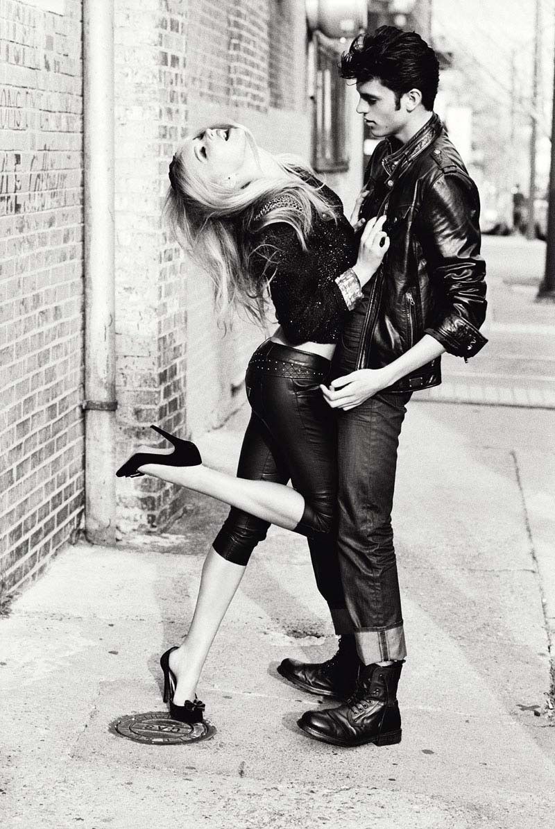 couple in leather on sidewalk