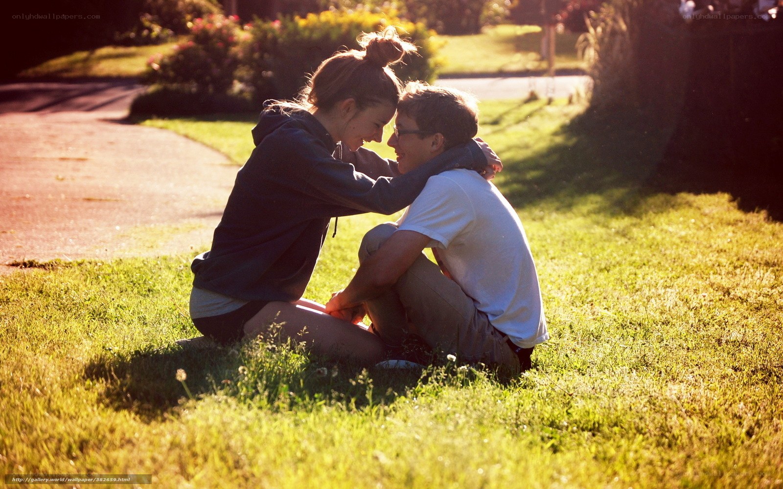 Couple in park embrace