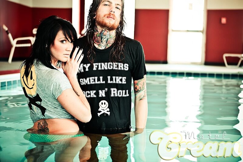 couple in pool with tattoos