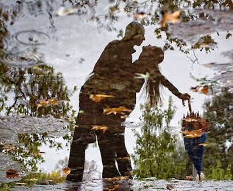 Couple in Puddle Reflection