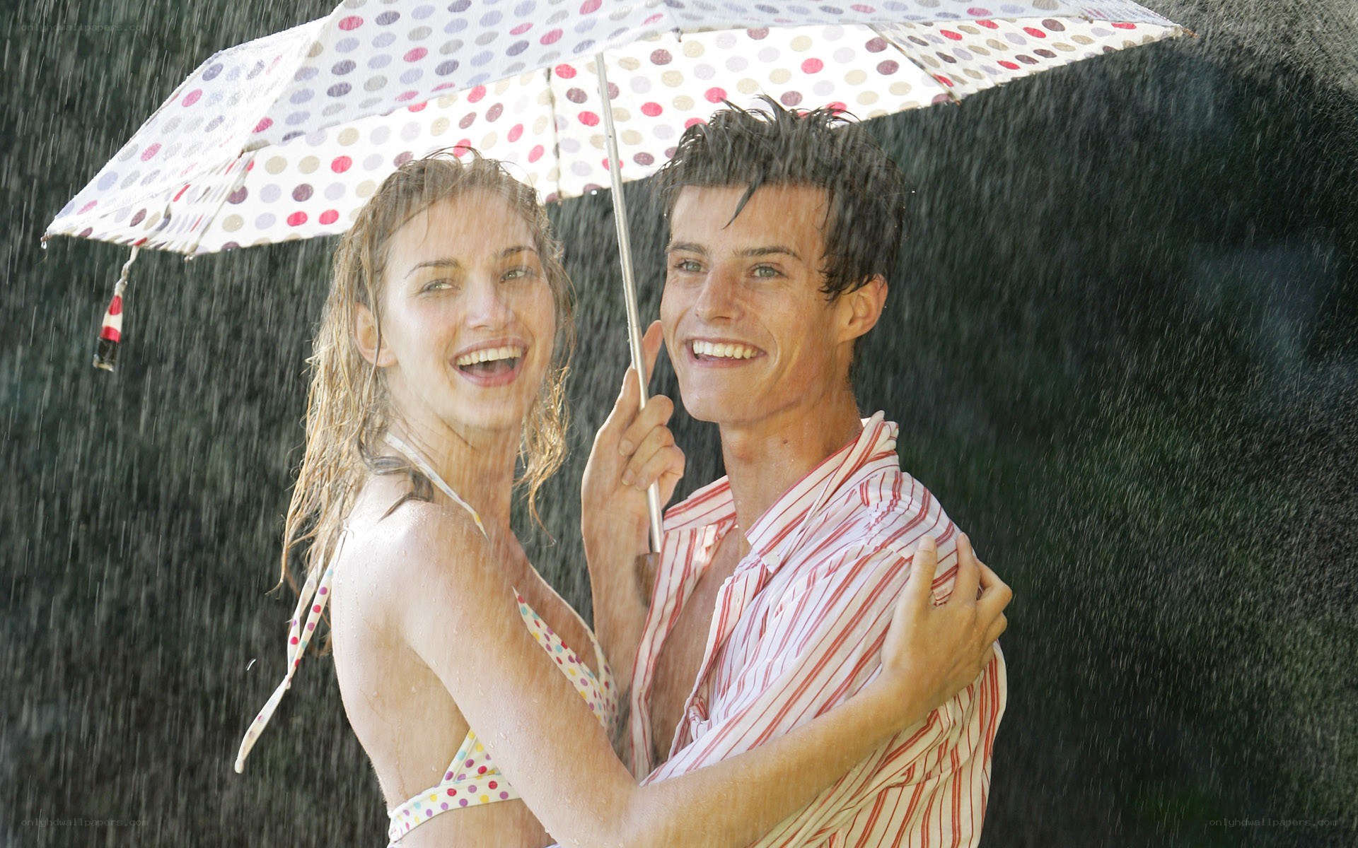 Couple in rain under umbrella