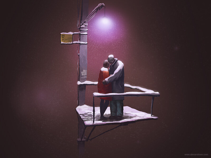 Couple in snow under streetlight