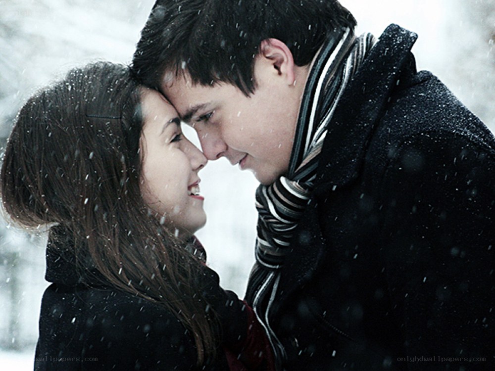 couple in snowfall