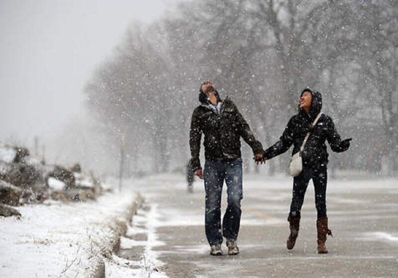 Couple in Snowstorm — White