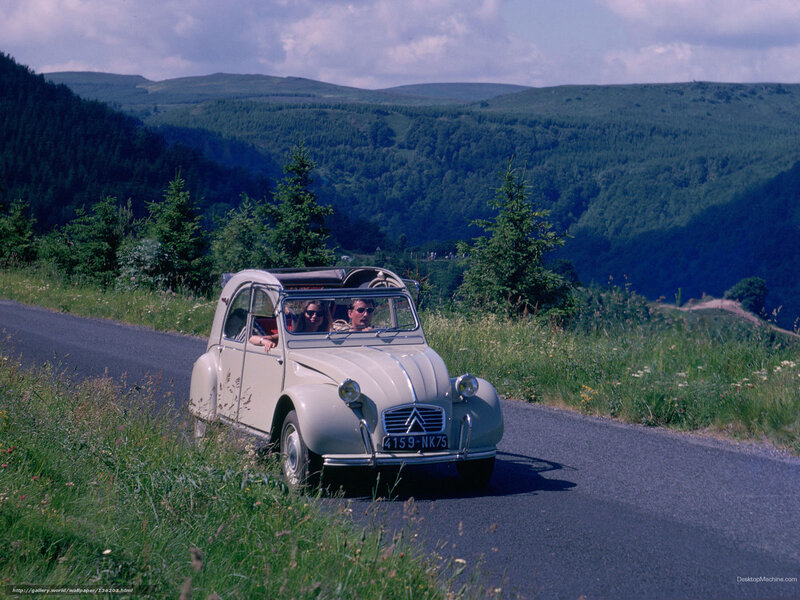 Couple in vintage car on scenic road