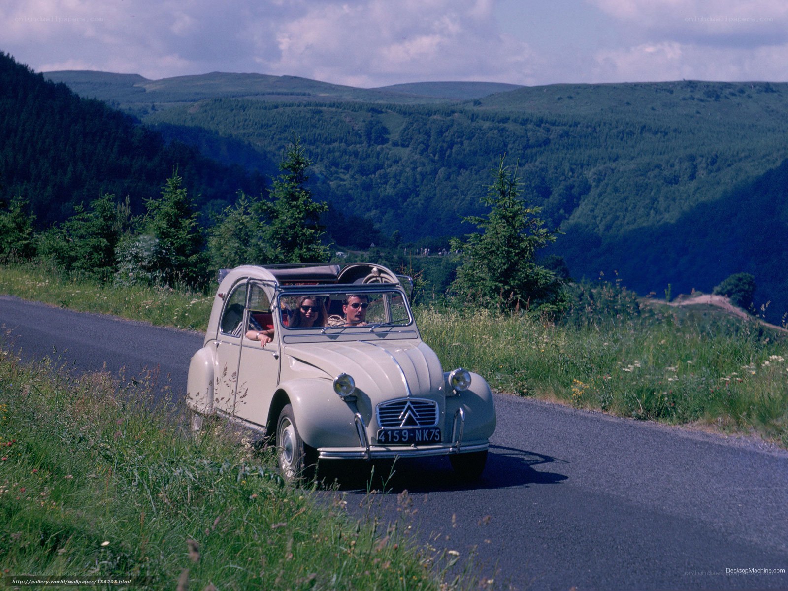 Couple in vintage car on scenic road
