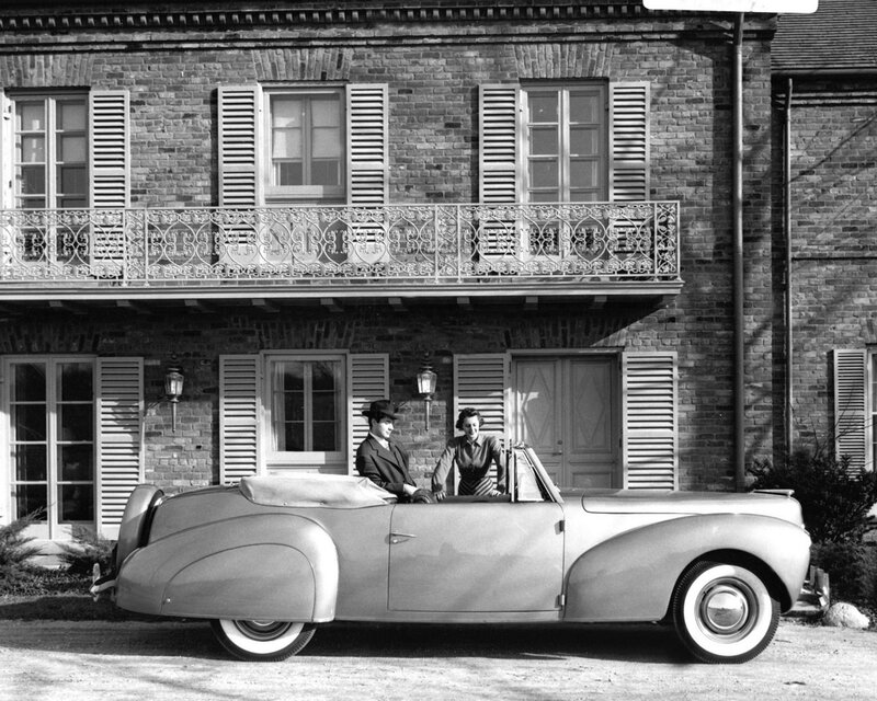 Couple in vintage convertible car