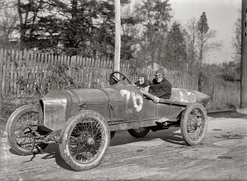 Couple in vintage race car