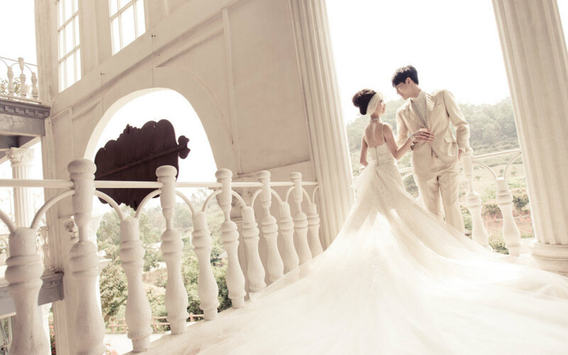 Couple in Wedding Attire — White, Romantic, Afternoon, Photograph, Balcony