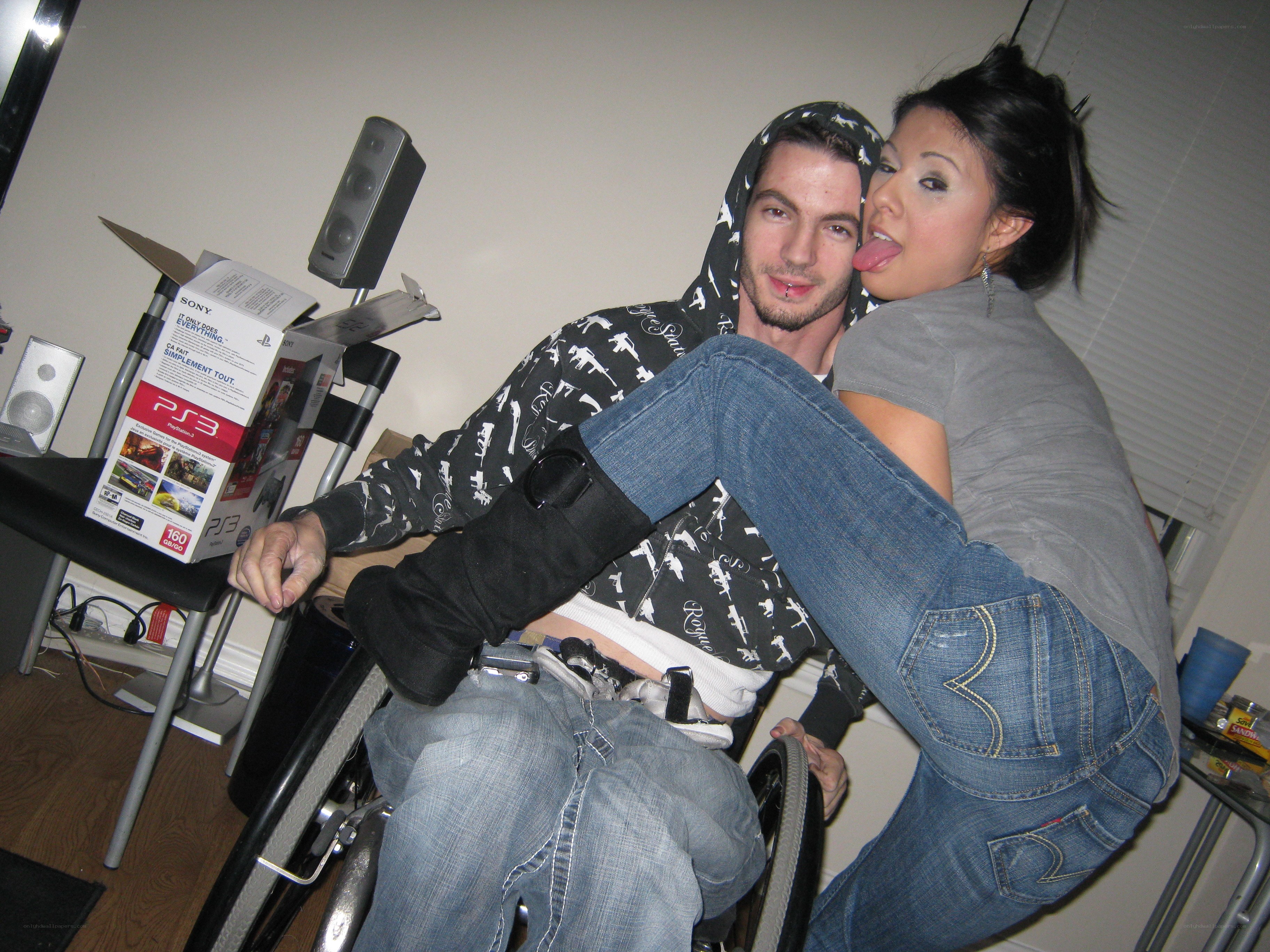 Couple in wheelchair posing playfully