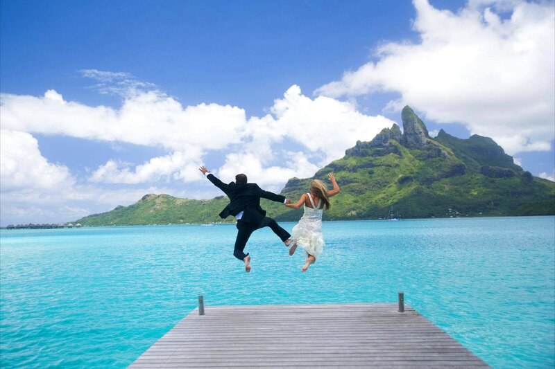 Couple Jumping into Water