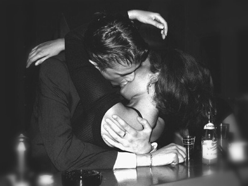 Couple Kissing at Bar