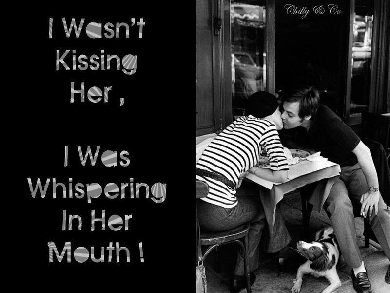 couple kissing at cafe