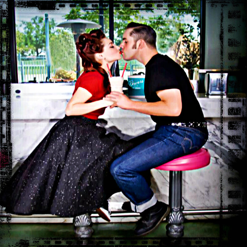 Couple Kissing at Diner