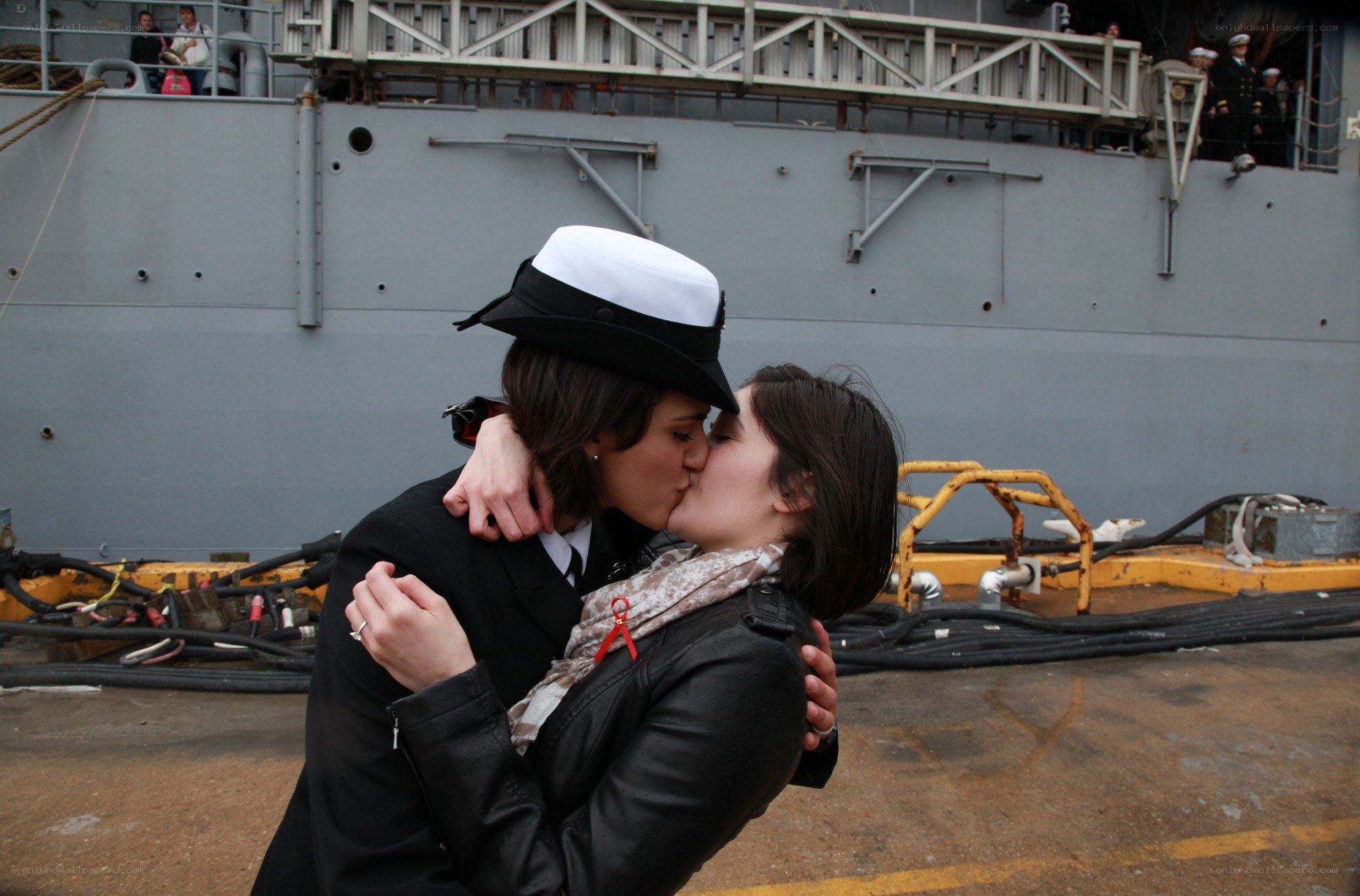 Couple kissing at dockside