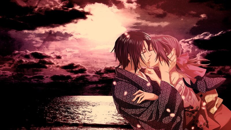 couple kissing at sunset