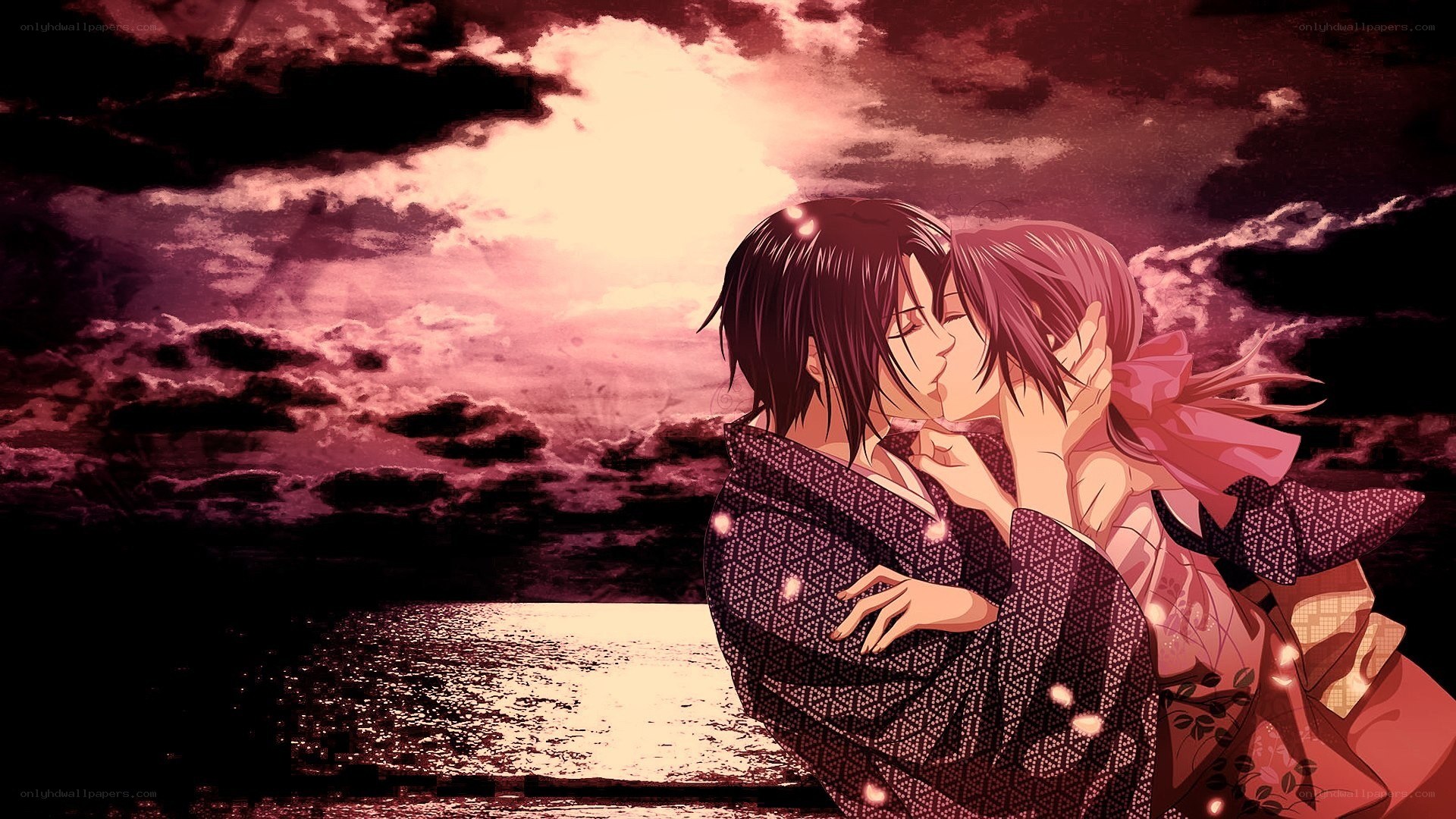 couple kissing at sunset