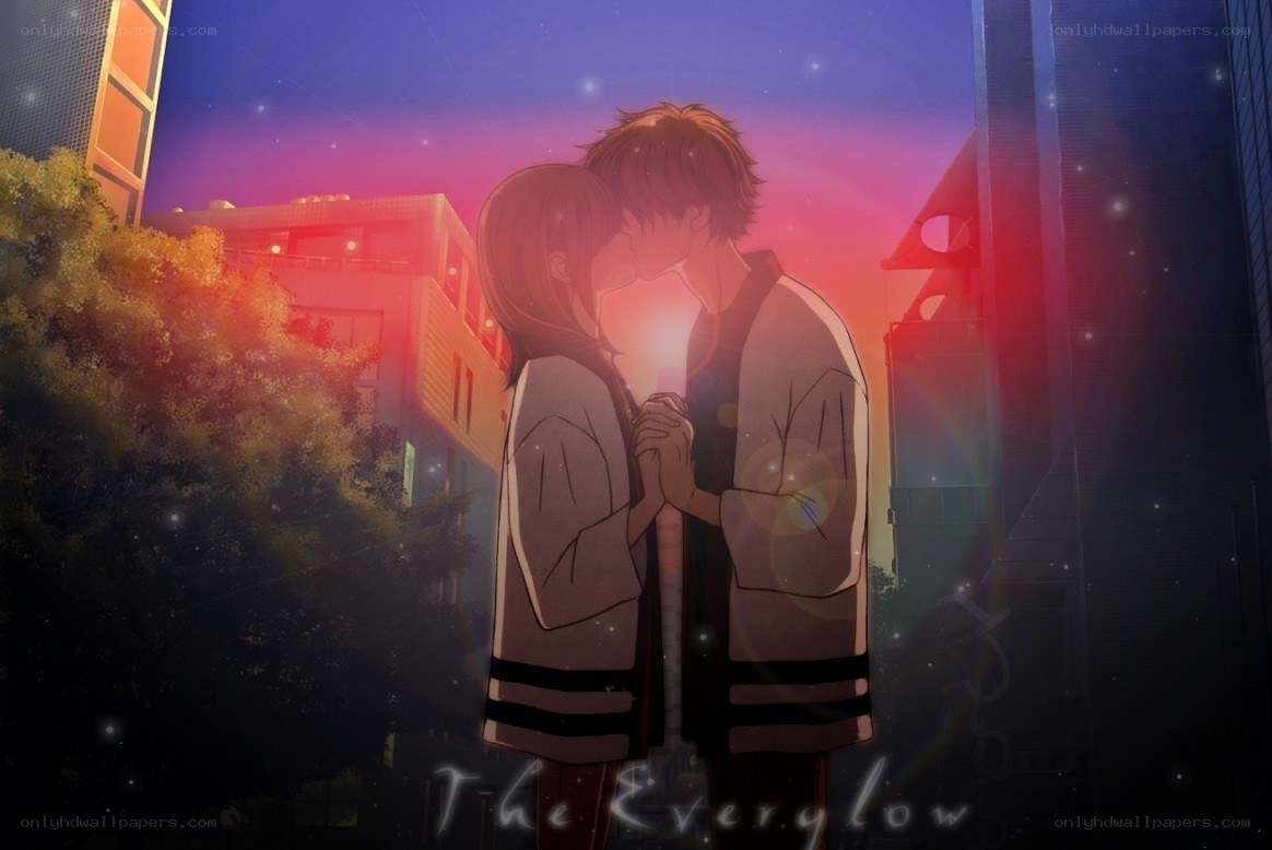 couple kissing at sunset