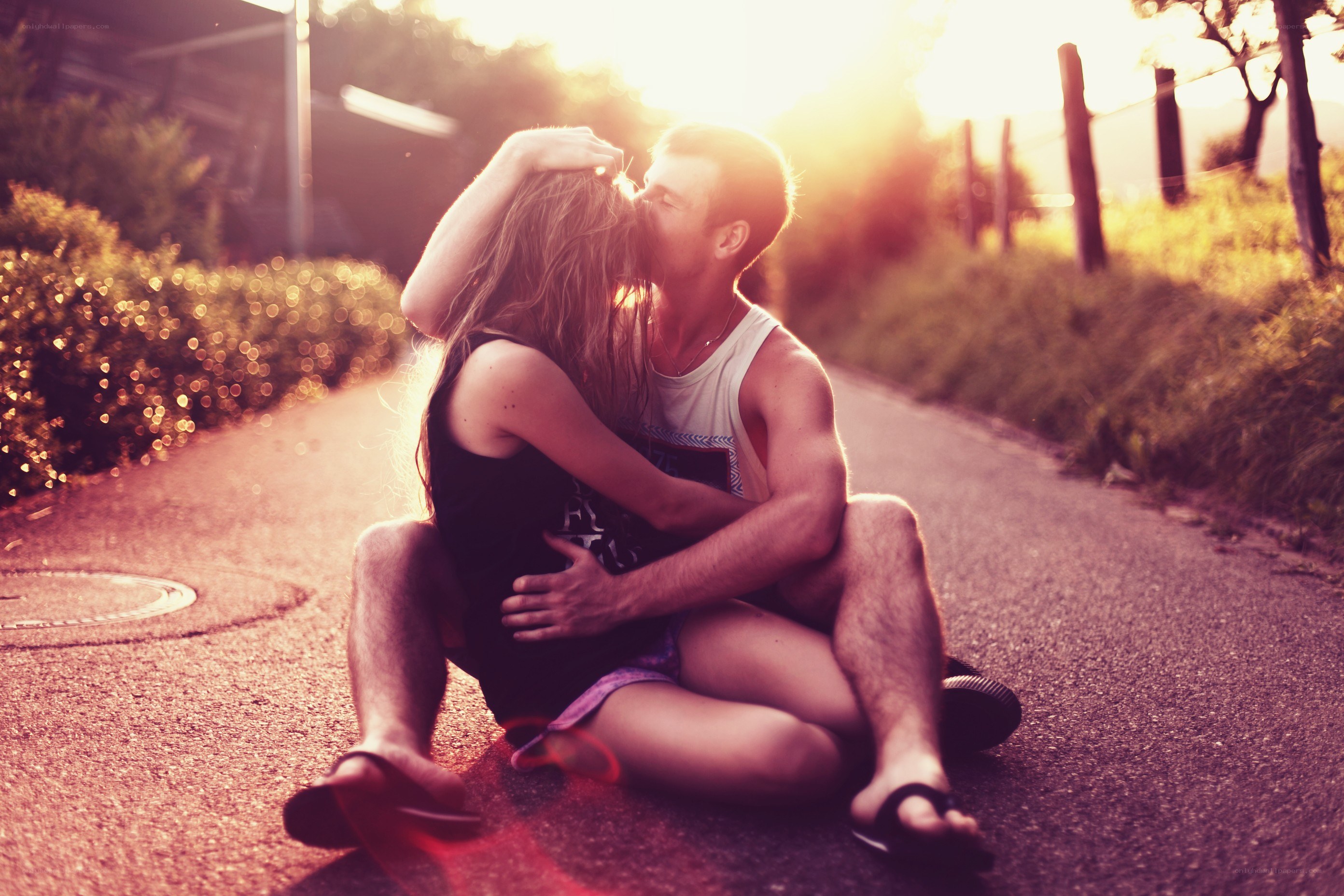 couple kissing at sunset