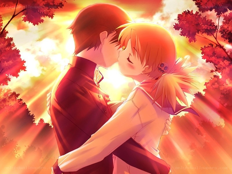 couple kissing at sunset