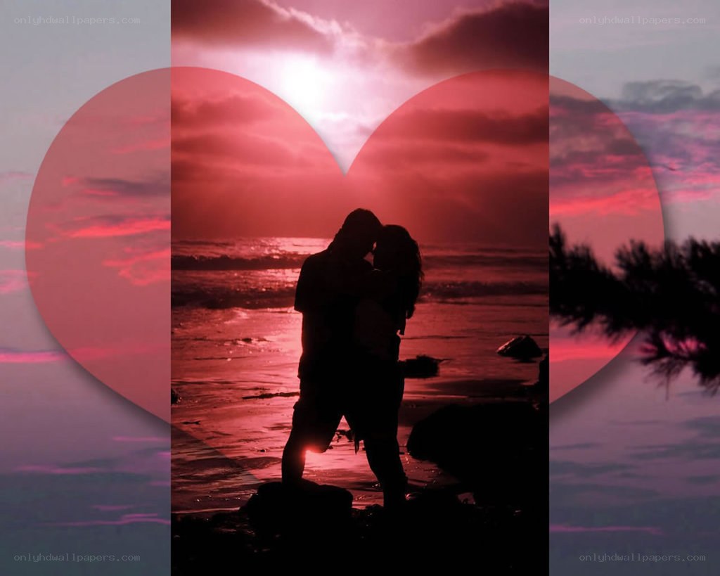 couple kissing at sunset