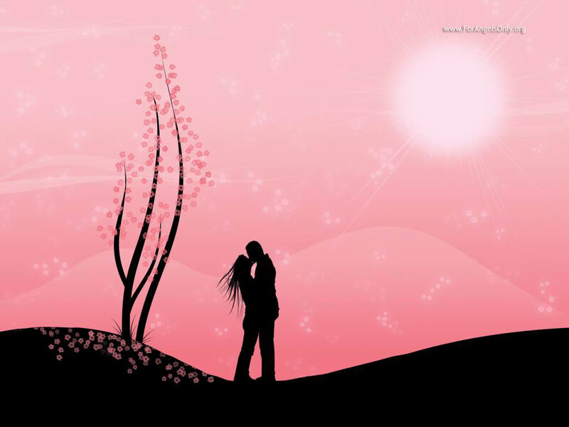 Couple kissing at sunset