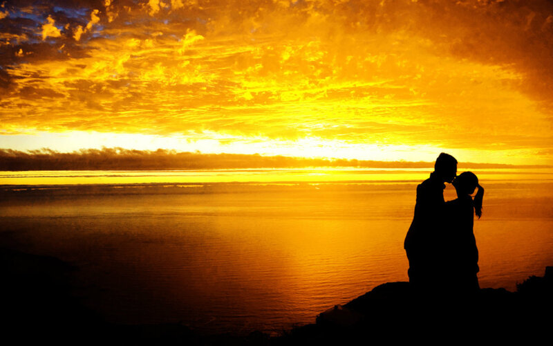 Couple Kissing at Sunset — Orange, Dramatic, Photograph