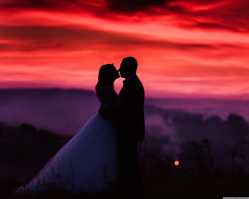 Couple Kissing at Sunset — Red, Dramatic