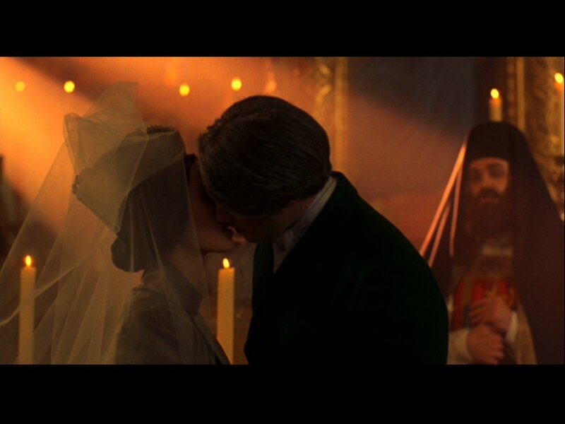Couple Kissing at Wedding — Orange