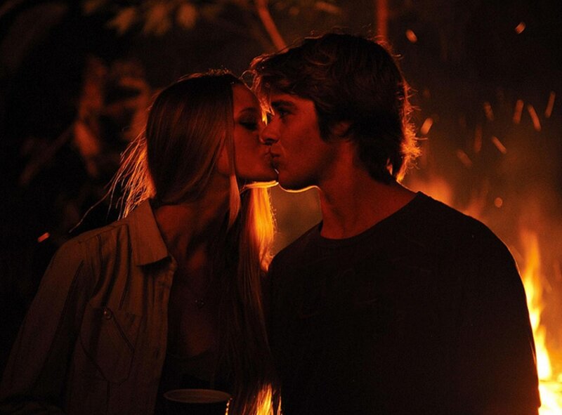Couple Kissing by Fire